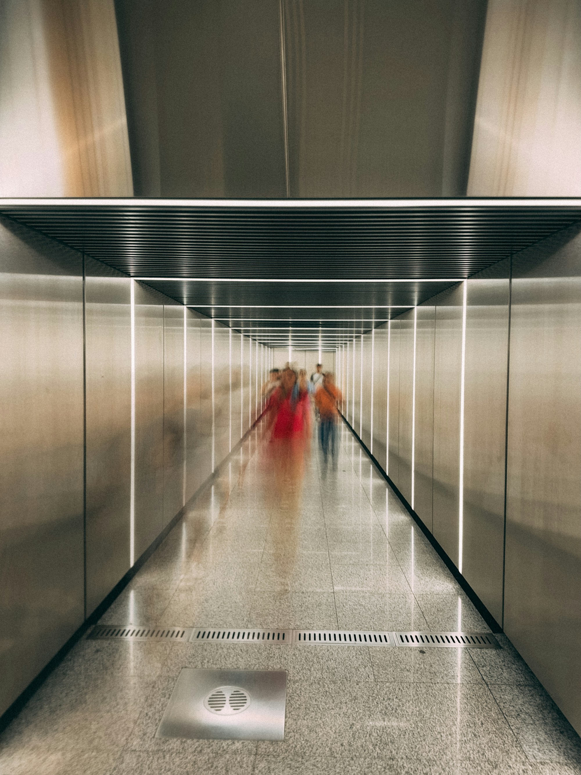 Receding futuristic tunnel of light symbolising the path into autonomous infrastructure